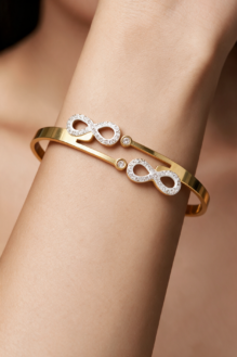 Eternal Spark Gold-Tone Double Infinity Crystal Cuff Bangle