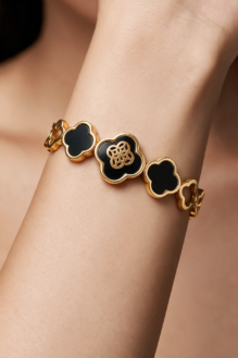 Gold-Tone Four-Leaf Clover Bracelet with Black Enamel Motifs